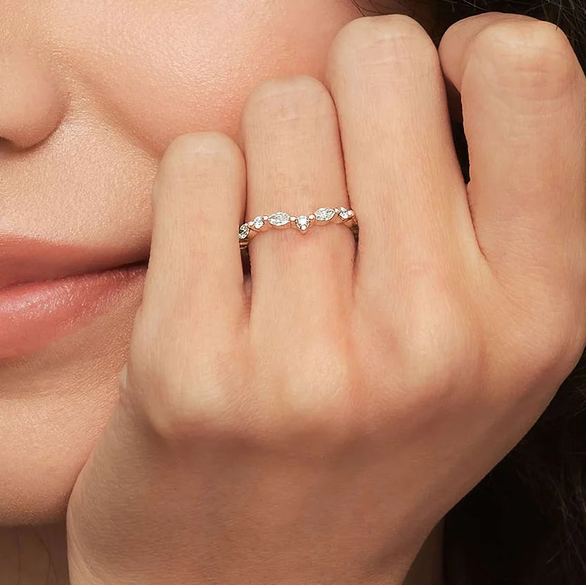 Rayonu Curved Versailles Lab Diamond Ring stacked with other rings
